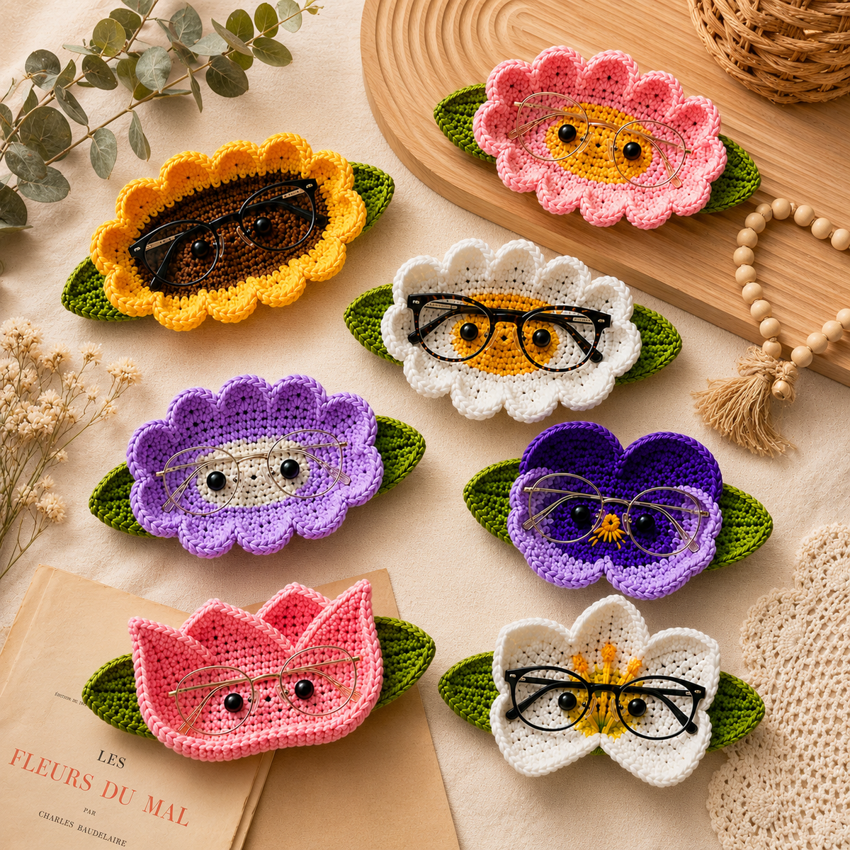 Crochet glasses holder floral collection featuring seven handmade styles including sunflower, daisies, pansy, tulip, and butterfly-inspired designs.