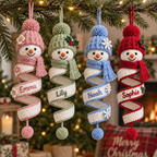 Four personalized crochet snowman spiral ornaments in blush, sage, blue, and red with custom names