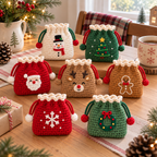 Seven crochet Christmas drawstring pouches featuring Snowman, Tree, Santa, Reindeer, Gingerbread, Snowflake, and Wreath styles