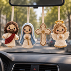 Four handmade crochet car hanging styles including Jesus Blessing, Mother Mary, Holy Cross, and Guardian Angel displayed together inside a car