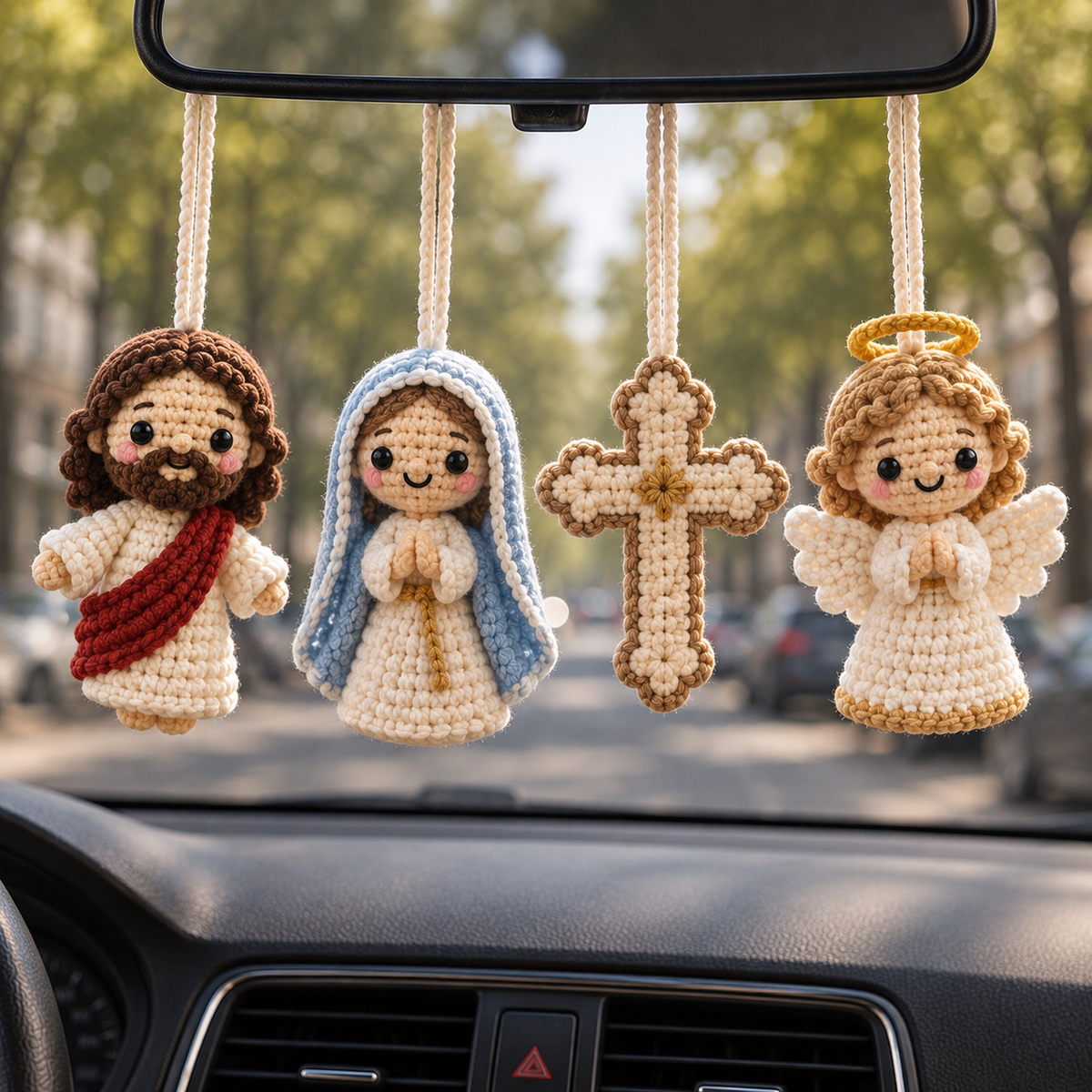 Four handmade crochet car hanging styles including Jesus Blessing, Mother Mary, Holy Cross, and Guardian Angel displayed together inside a car