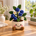 Blueberry crochet plant decor with blue berries, green leaves, and white flowers