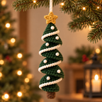 Evergreen crochet Christmas tree spiral ornament with white garland and gold star hanging near Christmas lights