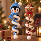 Penguin and Gingerbread crochet spiral ornaments displayed together in a warm holiday scene