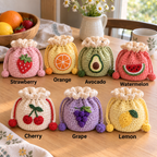 Seven crochet fruit drawstring pouch styles labeled Strawberry, Orange, Avocado, Watermelon, Cherry, Grape, and Lemon