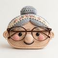 Grandma crochet glasses holder with gray bun, floral headband, rosy cheeks, and brown eyeglasses